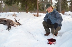 The author stirring the reindeer blood
